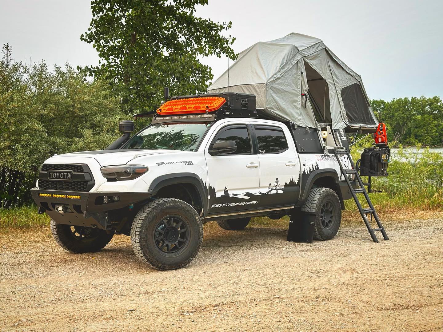 Skinny Guy Camper opened up near a lake